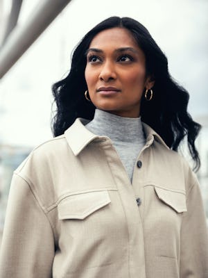 model wearing womens fusion overshirt taupe zoom upper chest shot looking sideways lifestyle