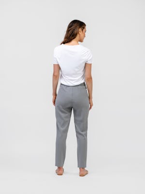 model wearing womens swift drape pant light grey and womens luxe touch tee white full body back shot