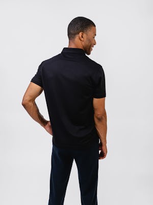 model wearing mens apollo polo black and mens fusion terry jogger black waist up back