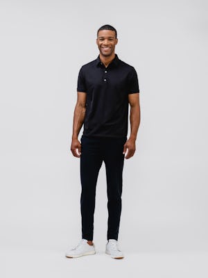 model wearing mens apollo polo black and mens fusion terry jogger black full body front arms on side