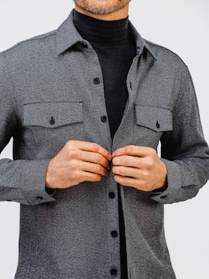 model wearing mens fusion overshirt black tweed  and mens kinetic tapered pant black zoom chest up body shot