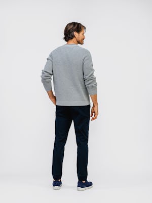 model wearing mens atlas waffle roll neck sweater grey heather and mens kinetic jogger navy back full body