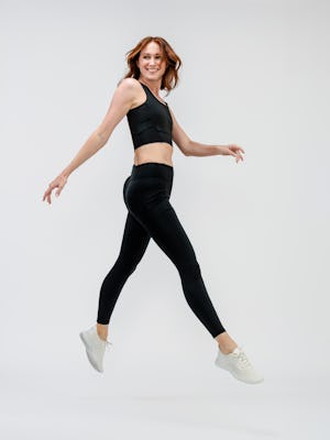 Black Joule Active Legging and Black Joule Tank on woman jumping in air