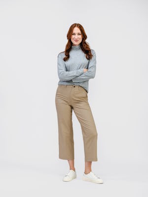 model wearing womens kinetic twill 5 pocket pant oatmeal heather and womens composite merino mock neck pale grey heather full body front
