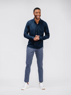 model wearing mens kinetic jogger slate blue and mens apollo raglan sport shirt navy standing holding hands together