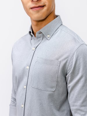 model wearing mens hybrid button down shirt light grey stripe detail shot of collar and pocket