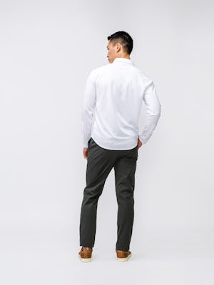 Back of White Men's Apollo Raglan Sport Shirt and Olive Kinetic Pant on model