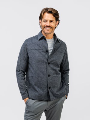 Men's Charcoal Fusion Chore Coat on model with hands in pant pockets