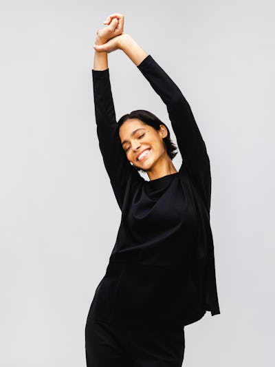 Black Women's Fusion Double Knit Tunic on model stretching arms out