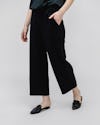 Black Swift Wide Leg Pant on woman walking with hand in pocket