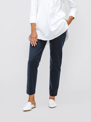 Women's Navy Kinetic Pull On Pant on model with hand in pocket