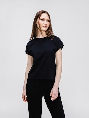 model wearing womens fusion double knit reversible tee black charcoal on model looking sideways
