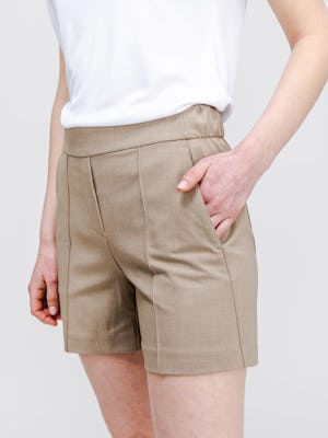 model wearing womens velocity tailored short flax one hand in pocket zoom