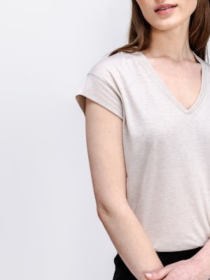 model wearing womens composite merino v neck tee taupe heather zoom