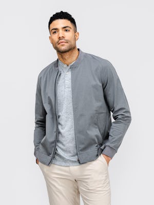 model wearing mens kinetic bomber jacket slate grey