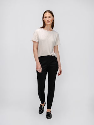 model wearing womens composite merino boxy tee taupe and womens kinetic pintuck pant black