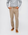 Sand Men's Kinetic Corduroy 5-Pocket Pant on model with hands in front pockets