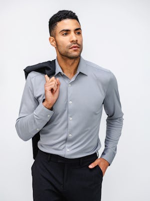 Men's New Grey Oxford Apollo Dress Shirt on model holding suit jacket over shoulder