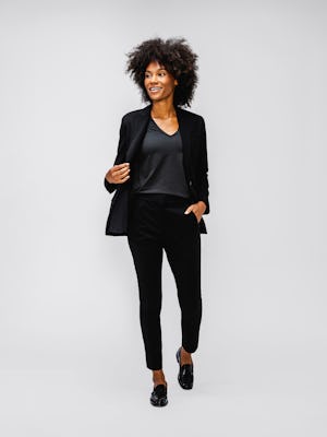 model wearing womens velocity oversized blazer black and womens velocity tapered pant black in studio
