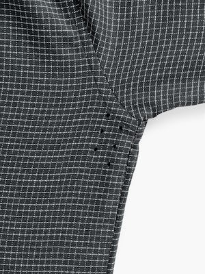 Close up of Men's Aero Zero Dress Shirt Charcoal Mini Grid on model raising arm