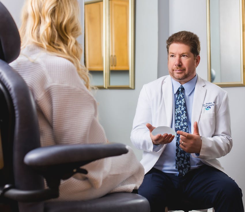 Dr. Joshua Kreithen speaking with patient