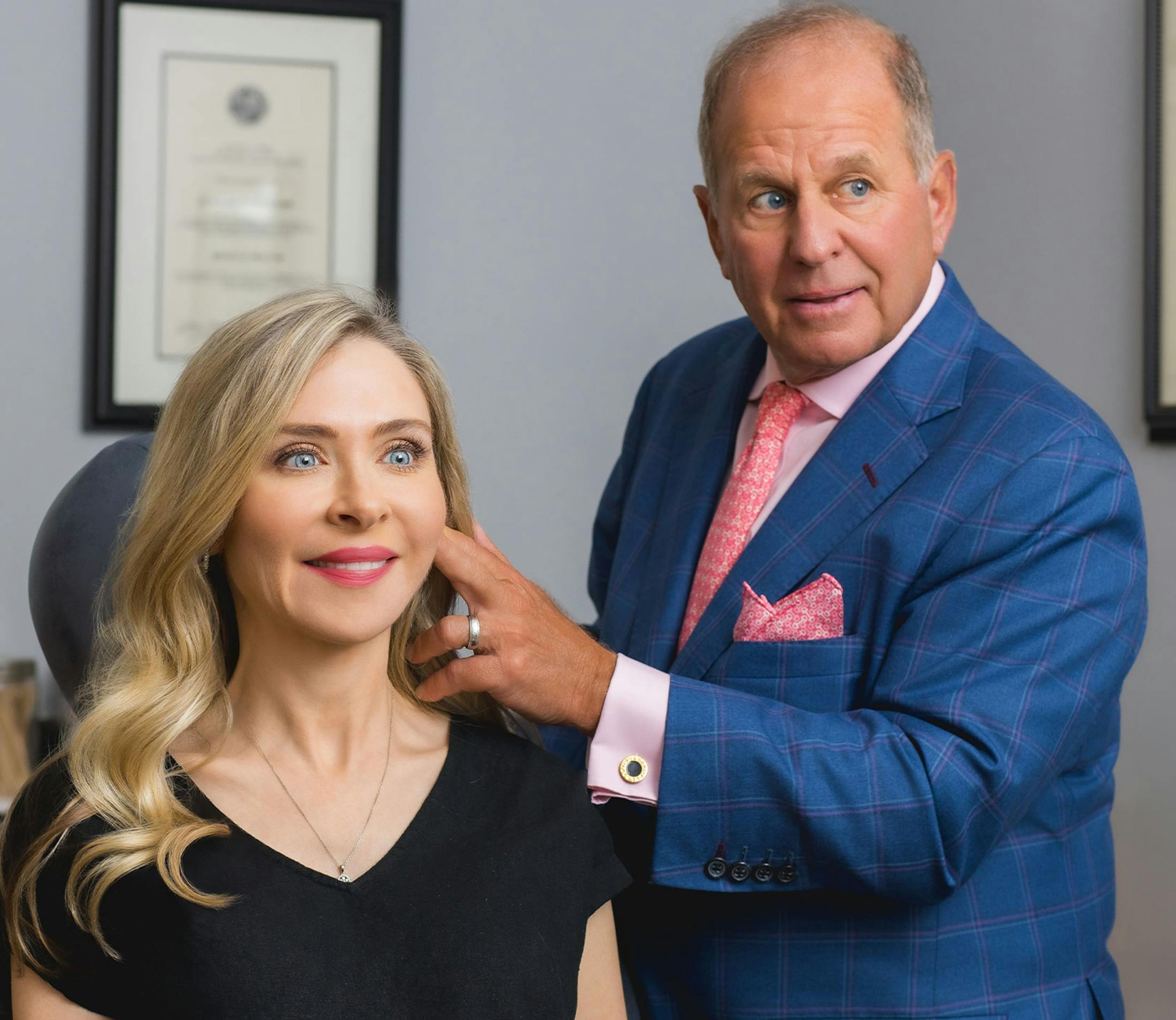 doctor pointing at female patient's face