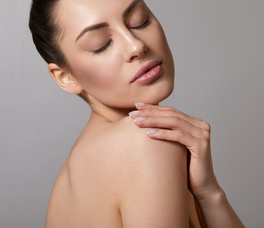 woman with head leaning in her shoulder and eyes closed