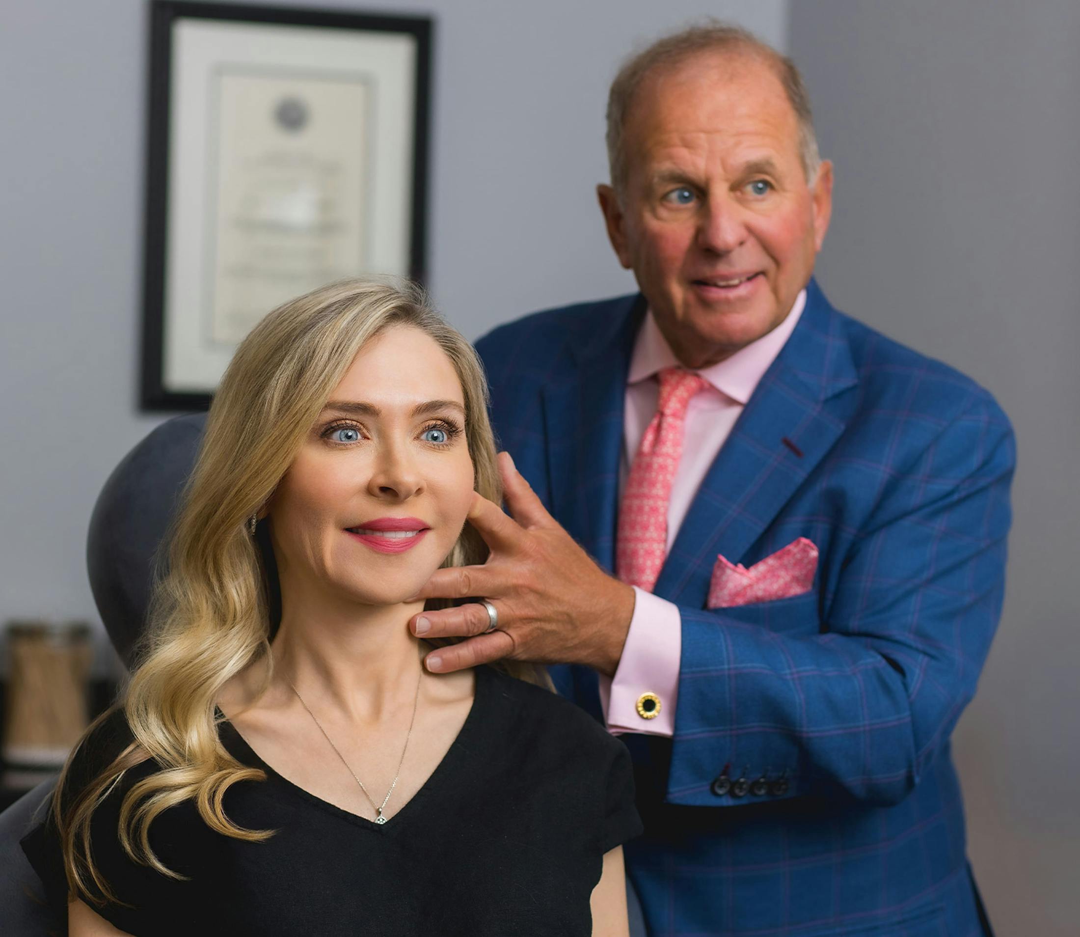 patient getting her cheeks viewed by doctor