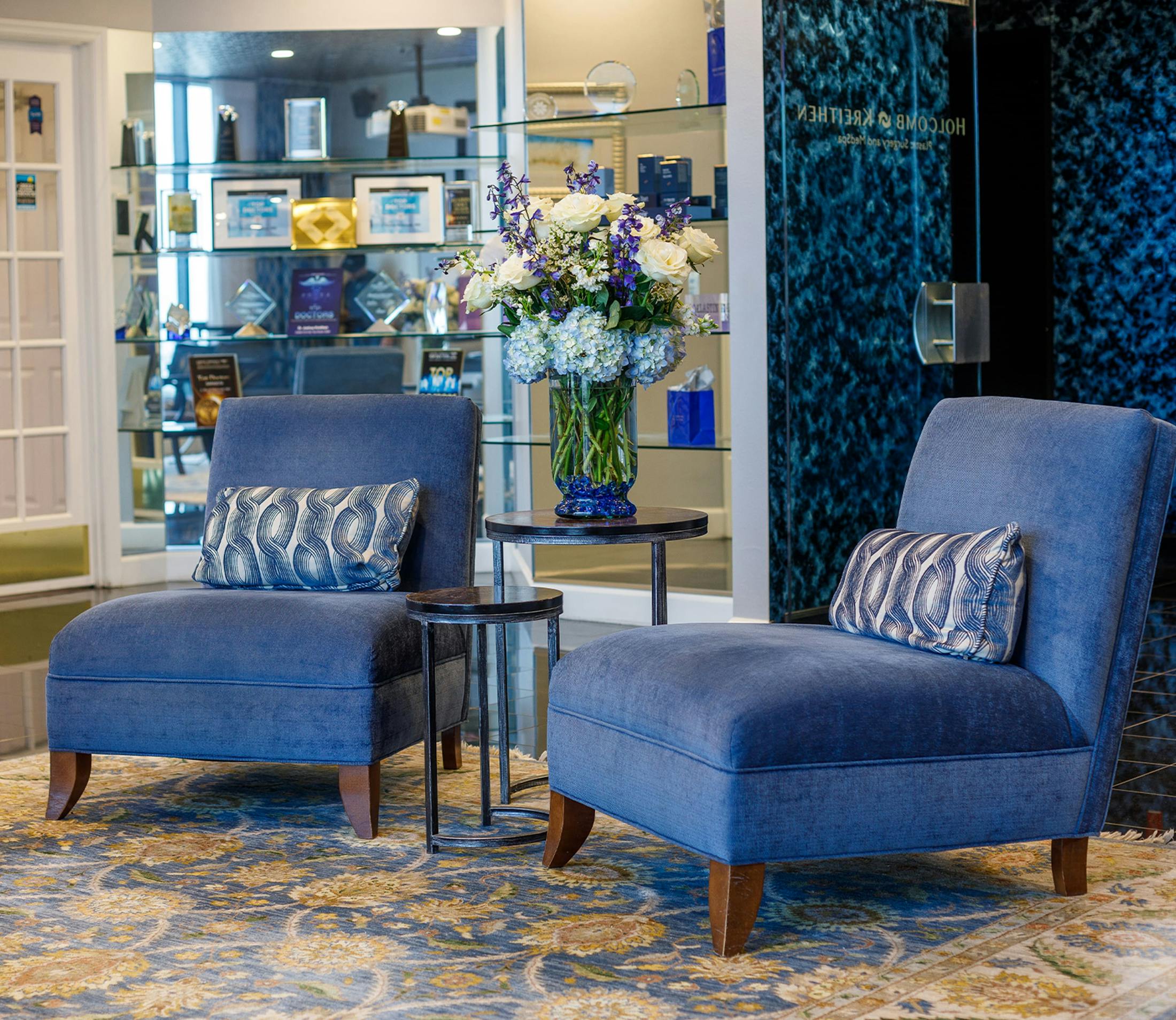 blue luxury chairs in Holcomb & Kreithen lobby