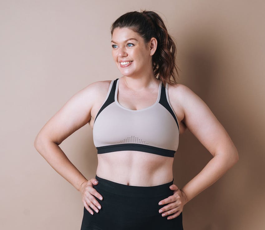 woman smiling with her hands on her hips