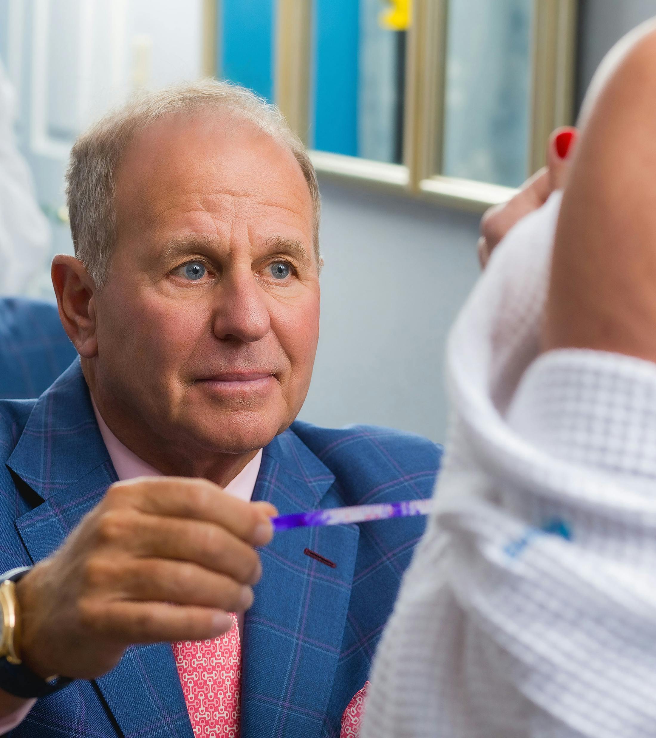 Dr. Salzman measuring patient's breast