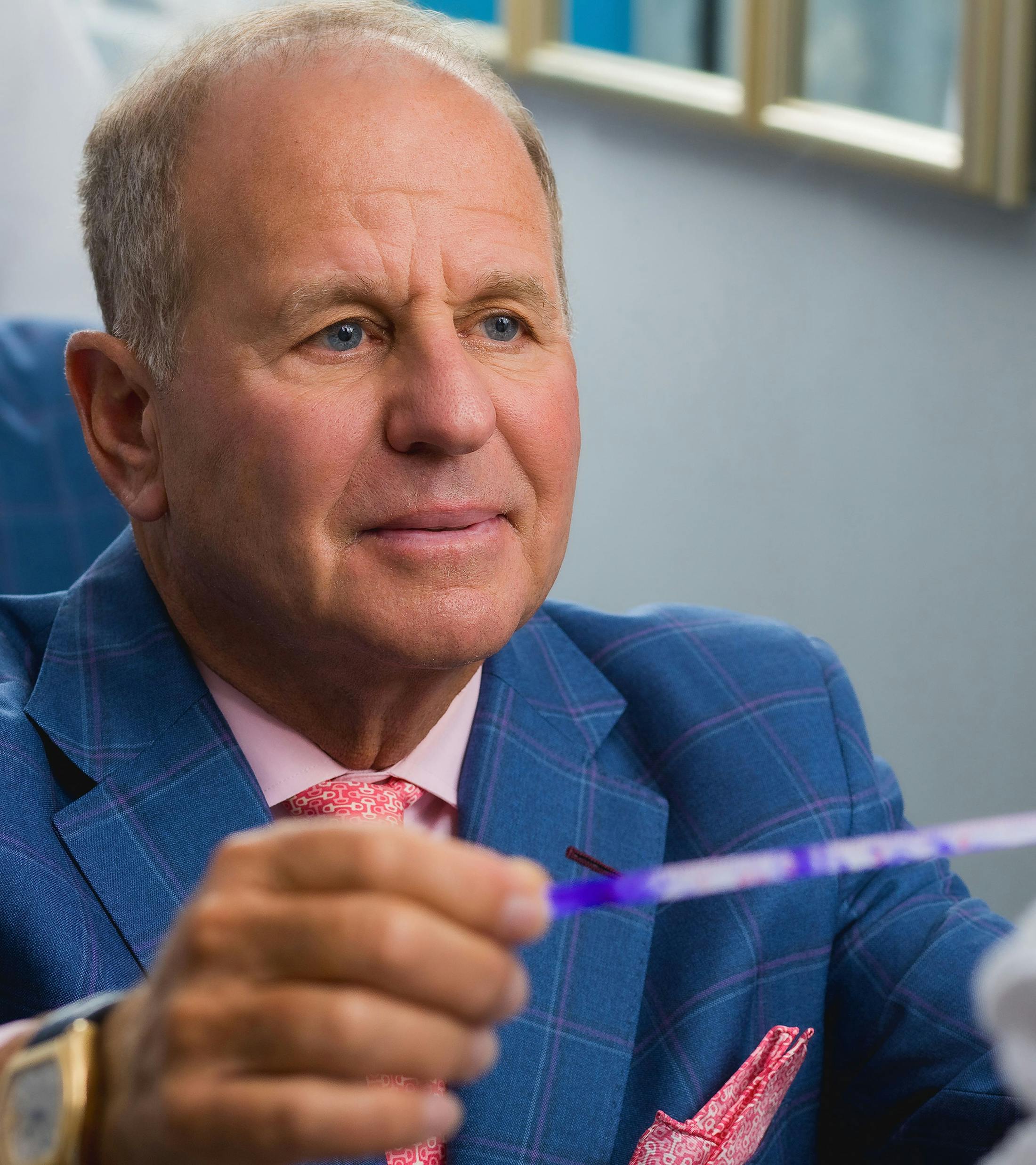 Dr. Salzman holding a medical test result in his hands