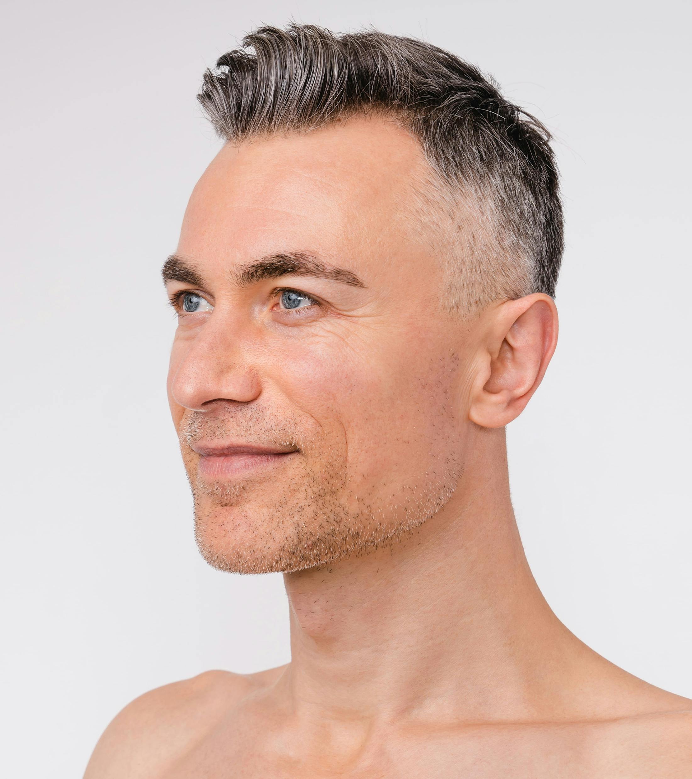 side profile of man's face as man looks forward