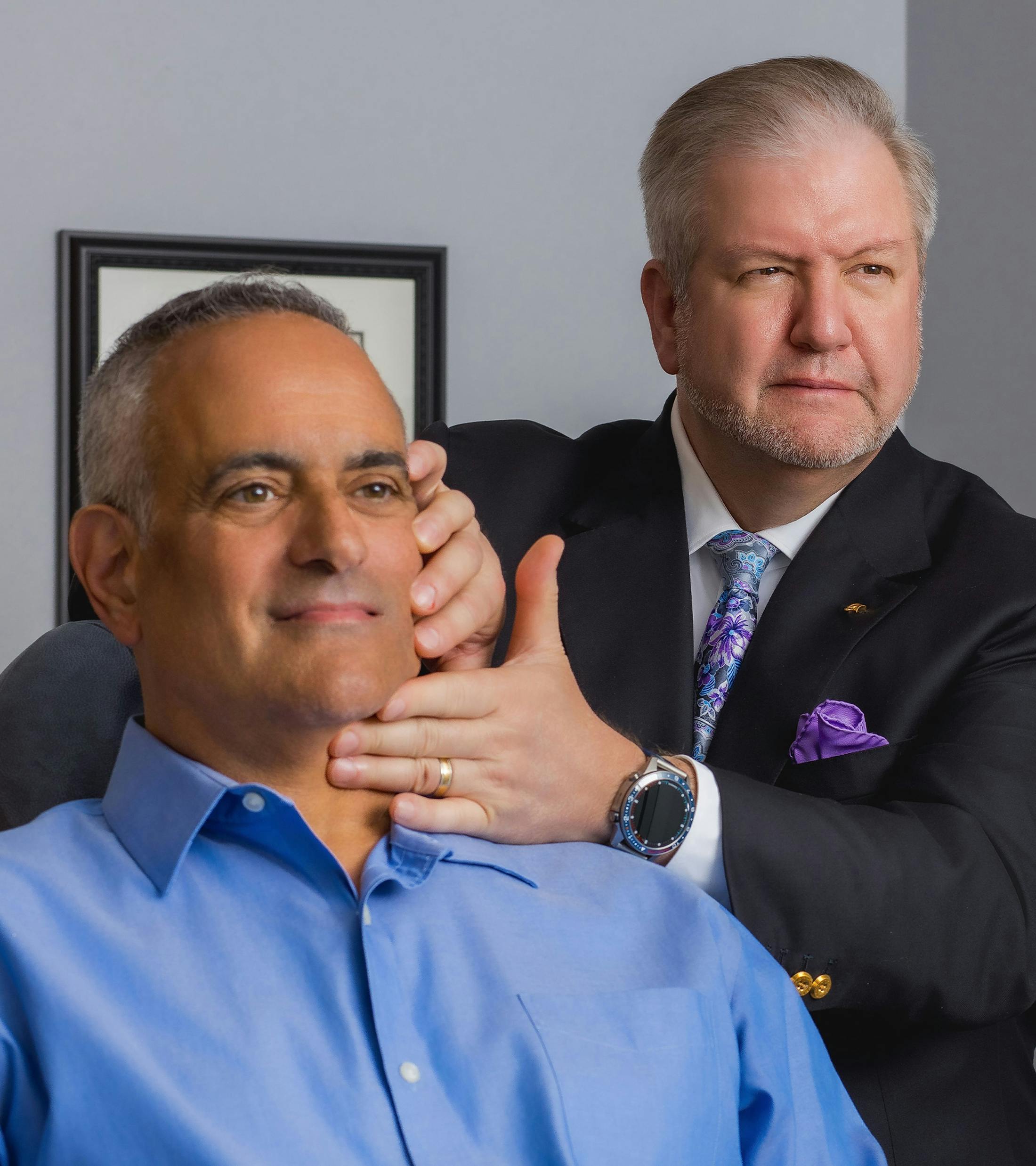 Doctor looking at male patient's face