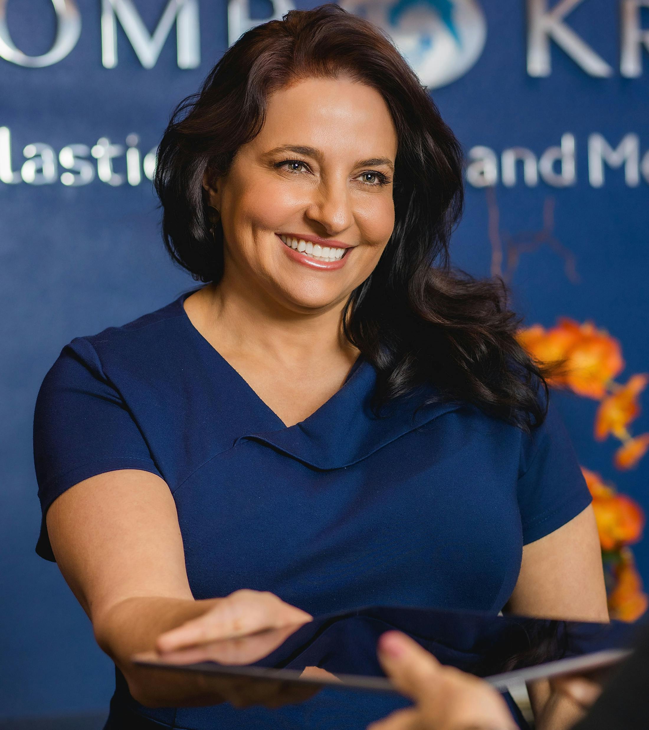 woman in blue in the Holcomb & Kreithen lobby