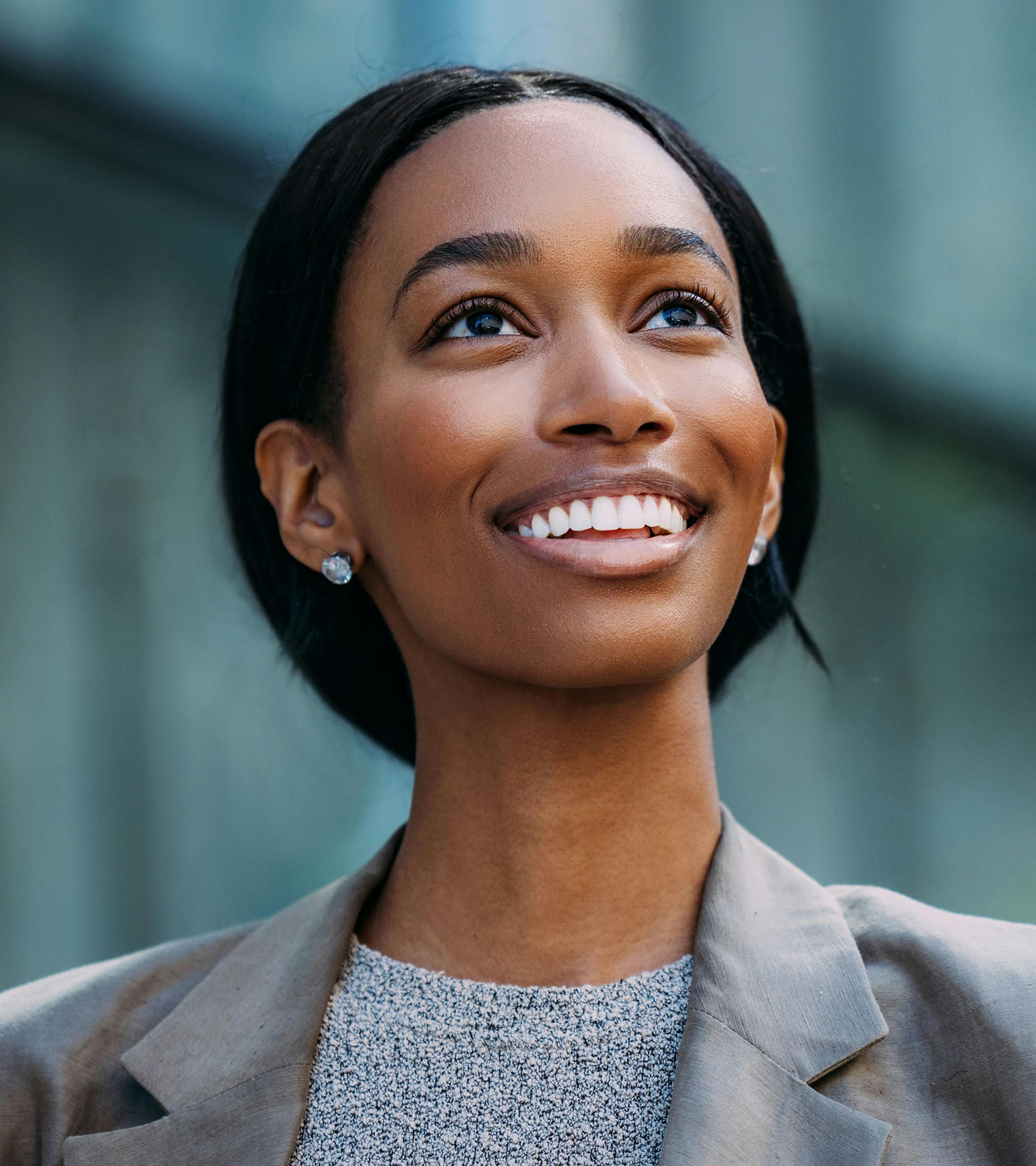 woman in grey sweater and grey blazer