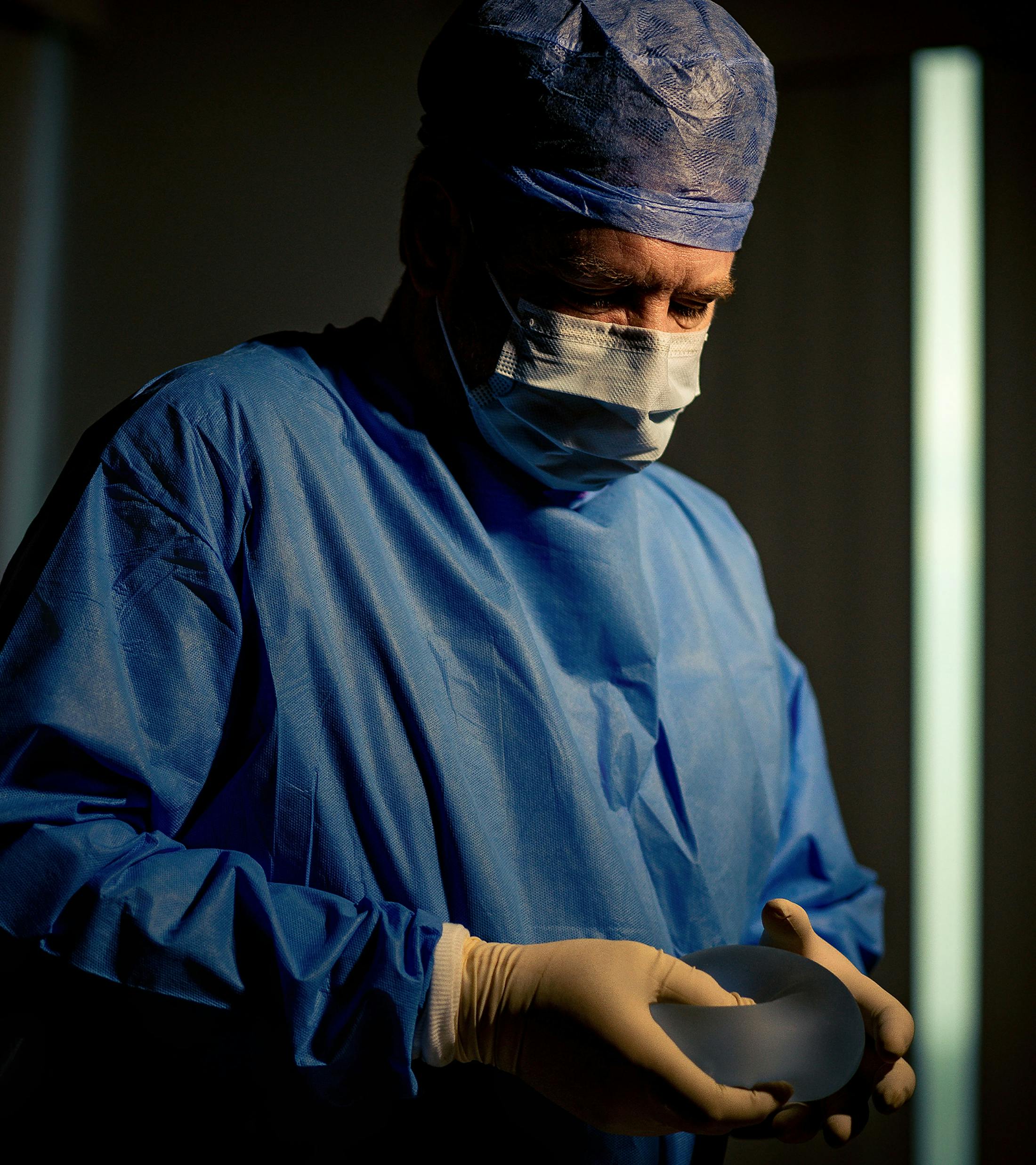 Dr. Kreithen holding an implant