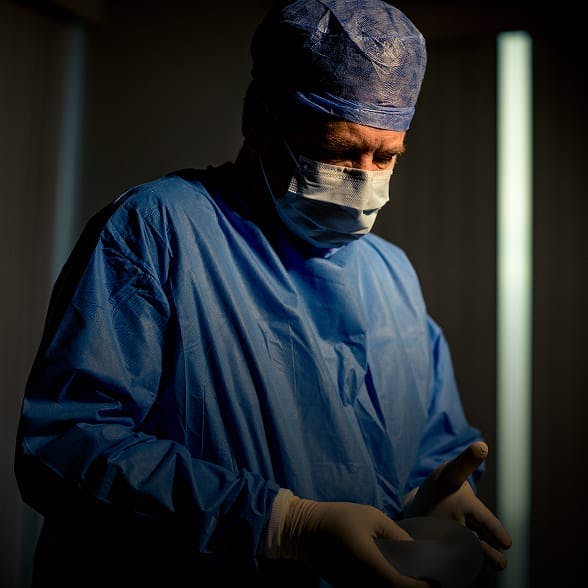 Doctor in scrubs at Holcomb Kreithen