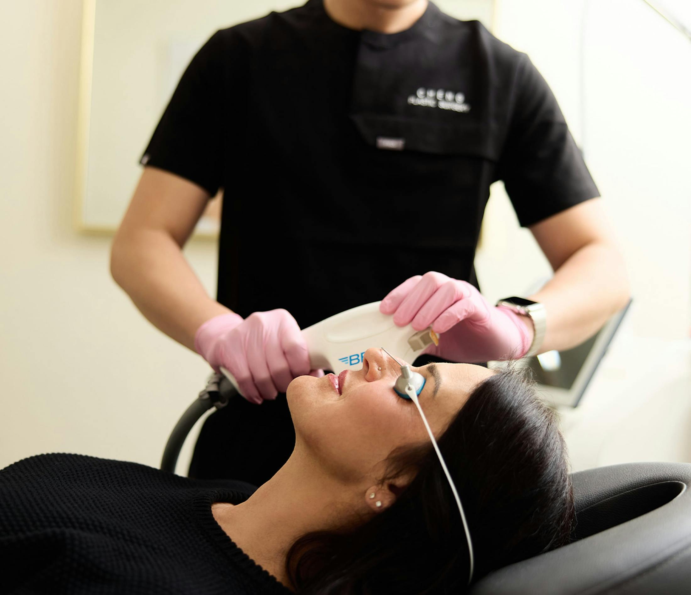 woman receiving facial treatment