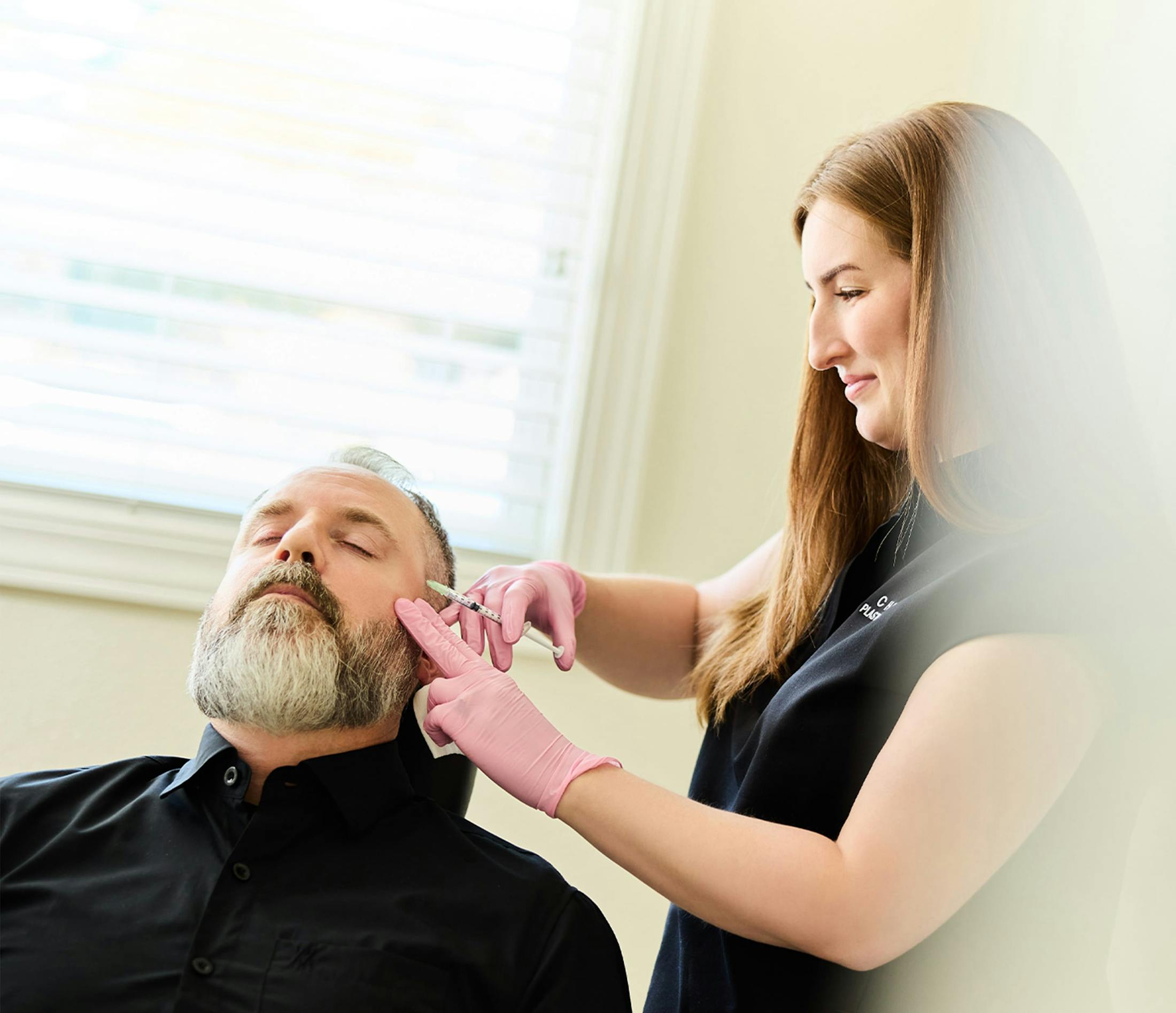 man receiving face injections
