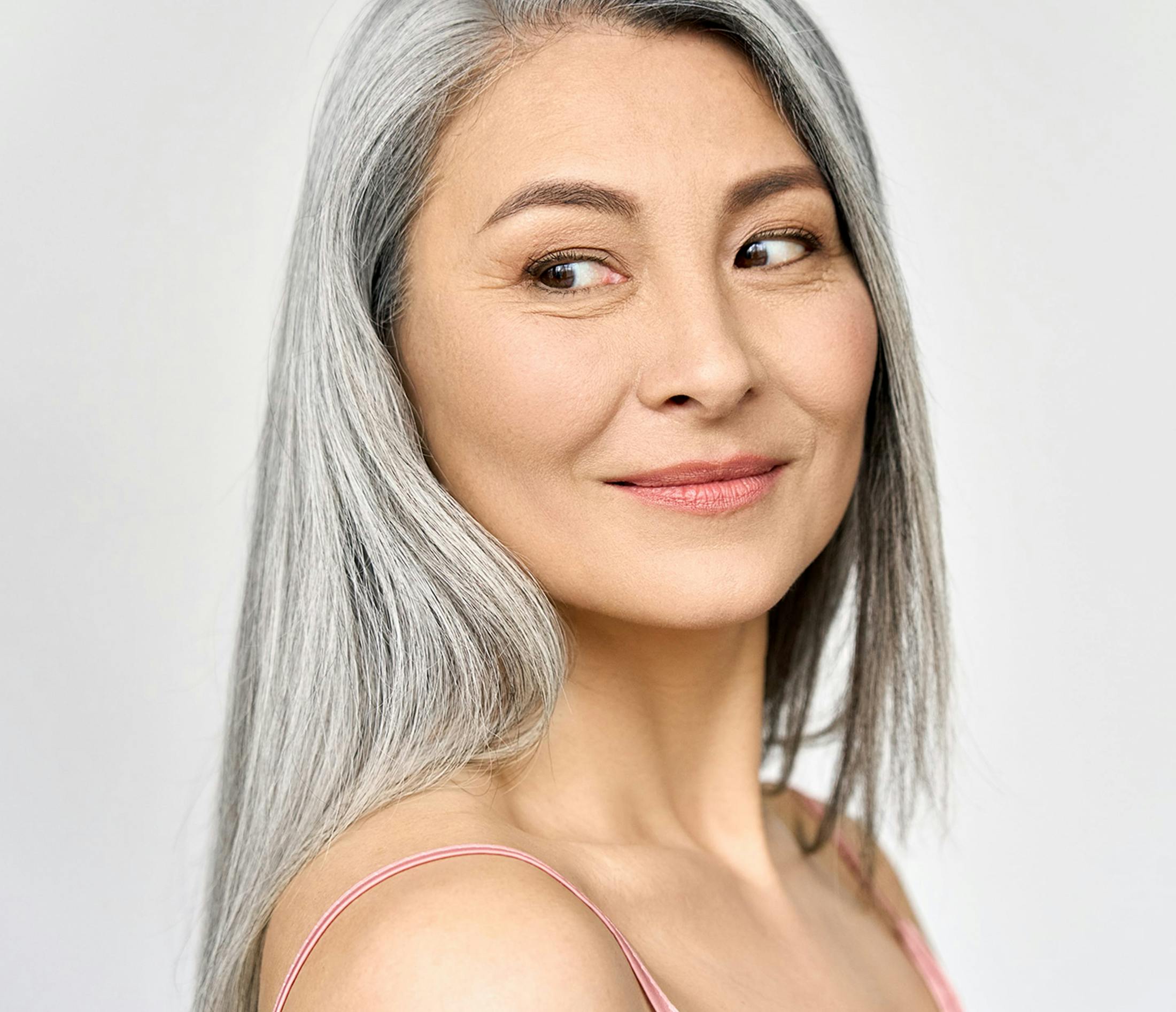 Woman looking over shoulder smiling