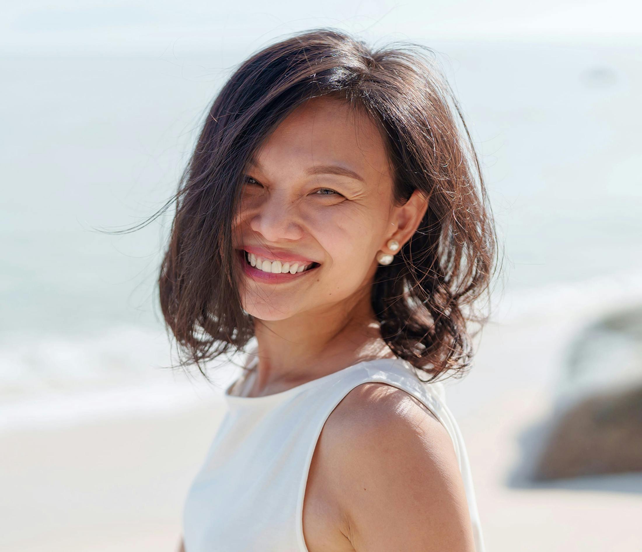 woman smiling at beach