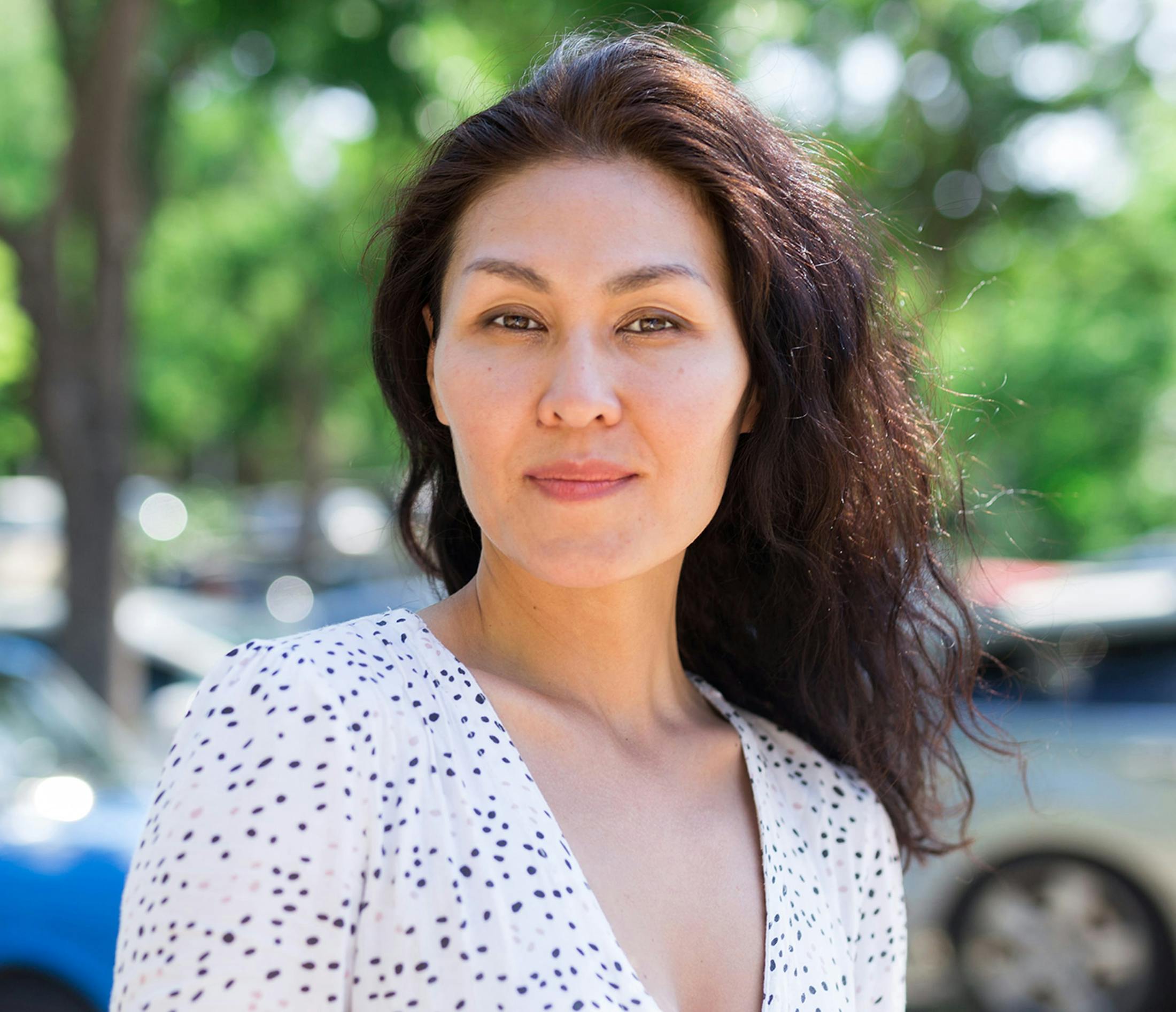 Woman outside with dark hair