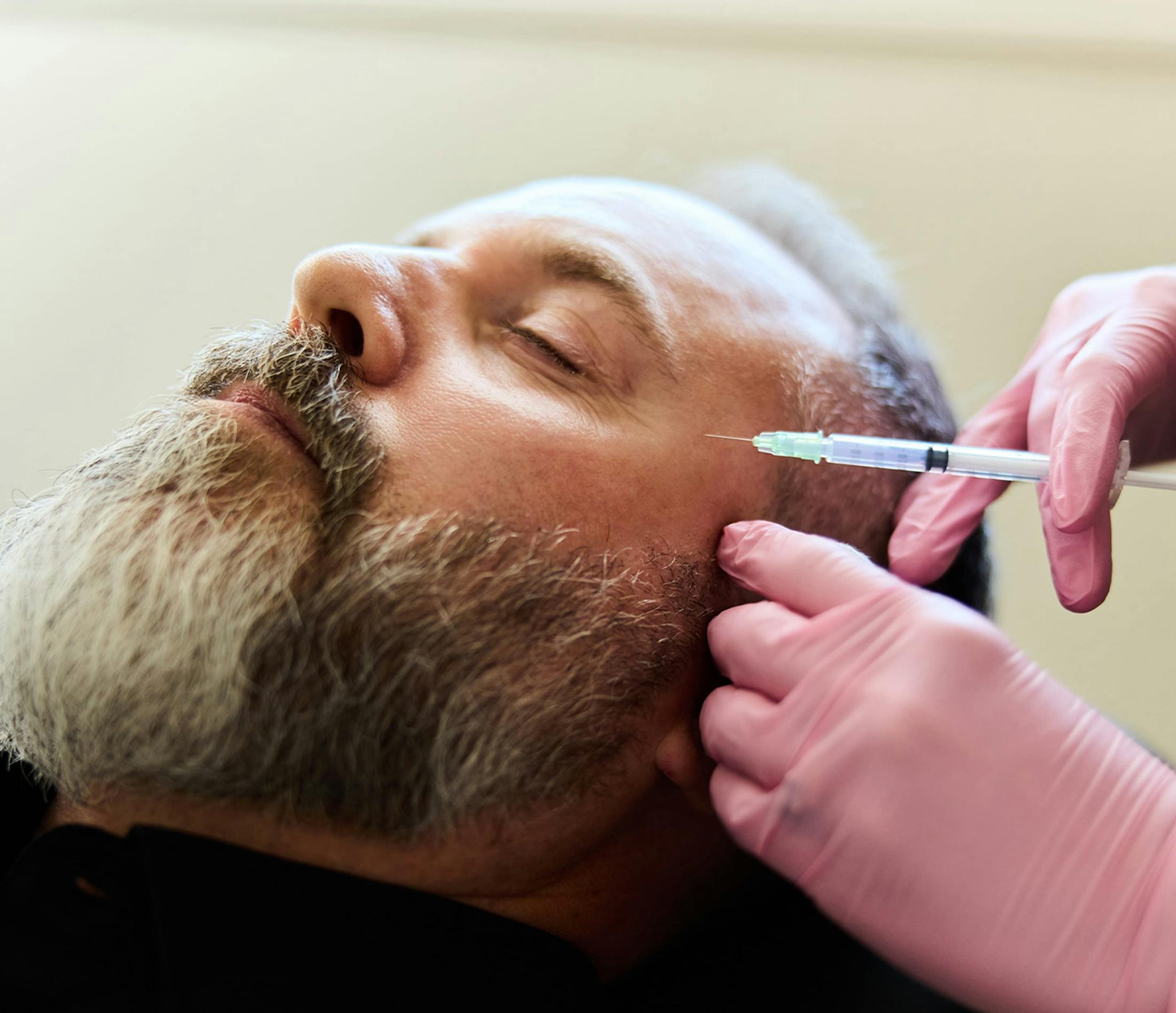 man receiving facial injections