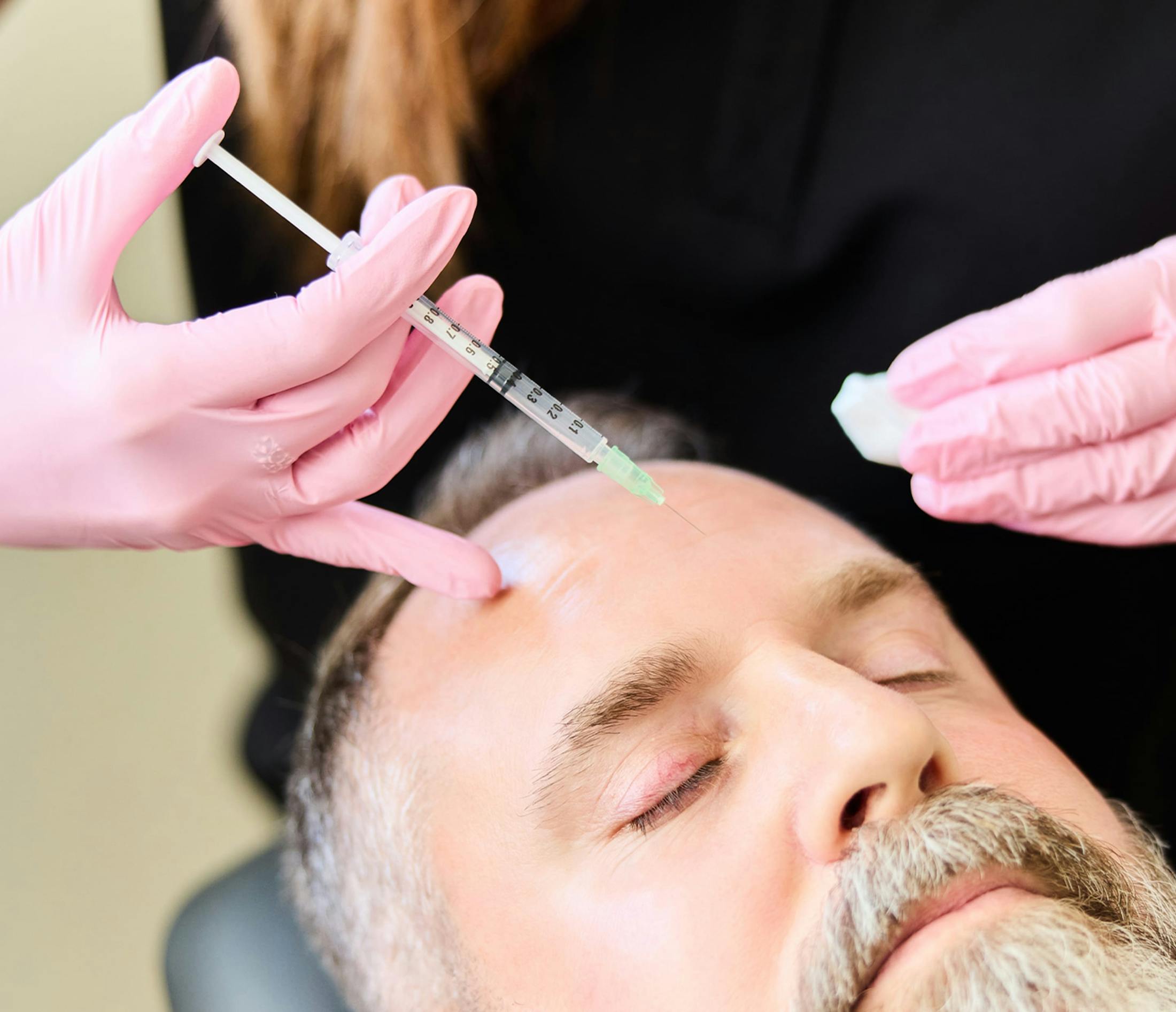 man receiving facial injections