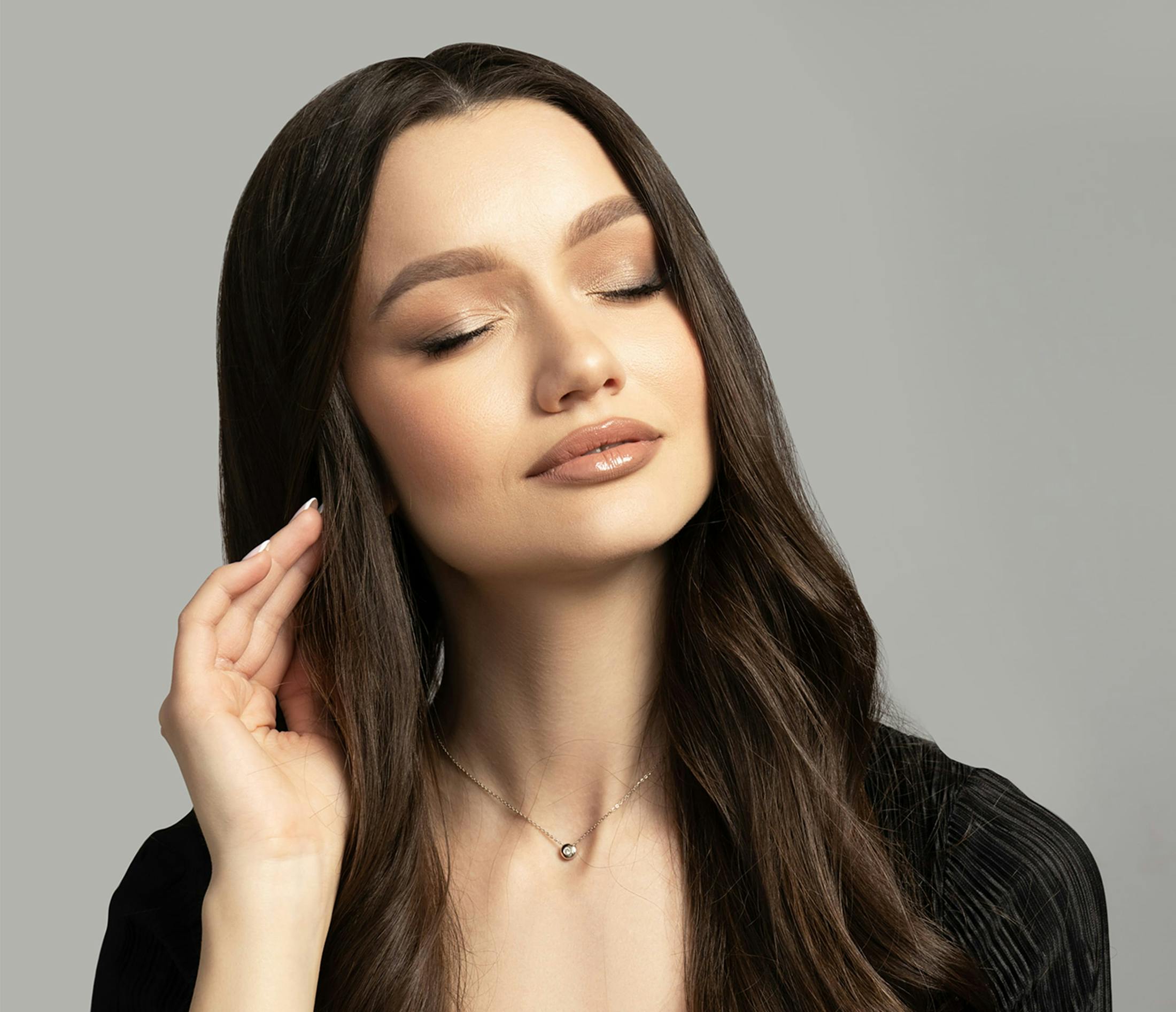 dark hair woman with eyes closed