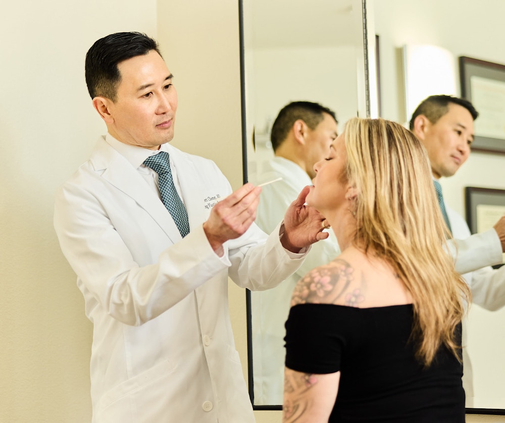 doctor examining female's face
