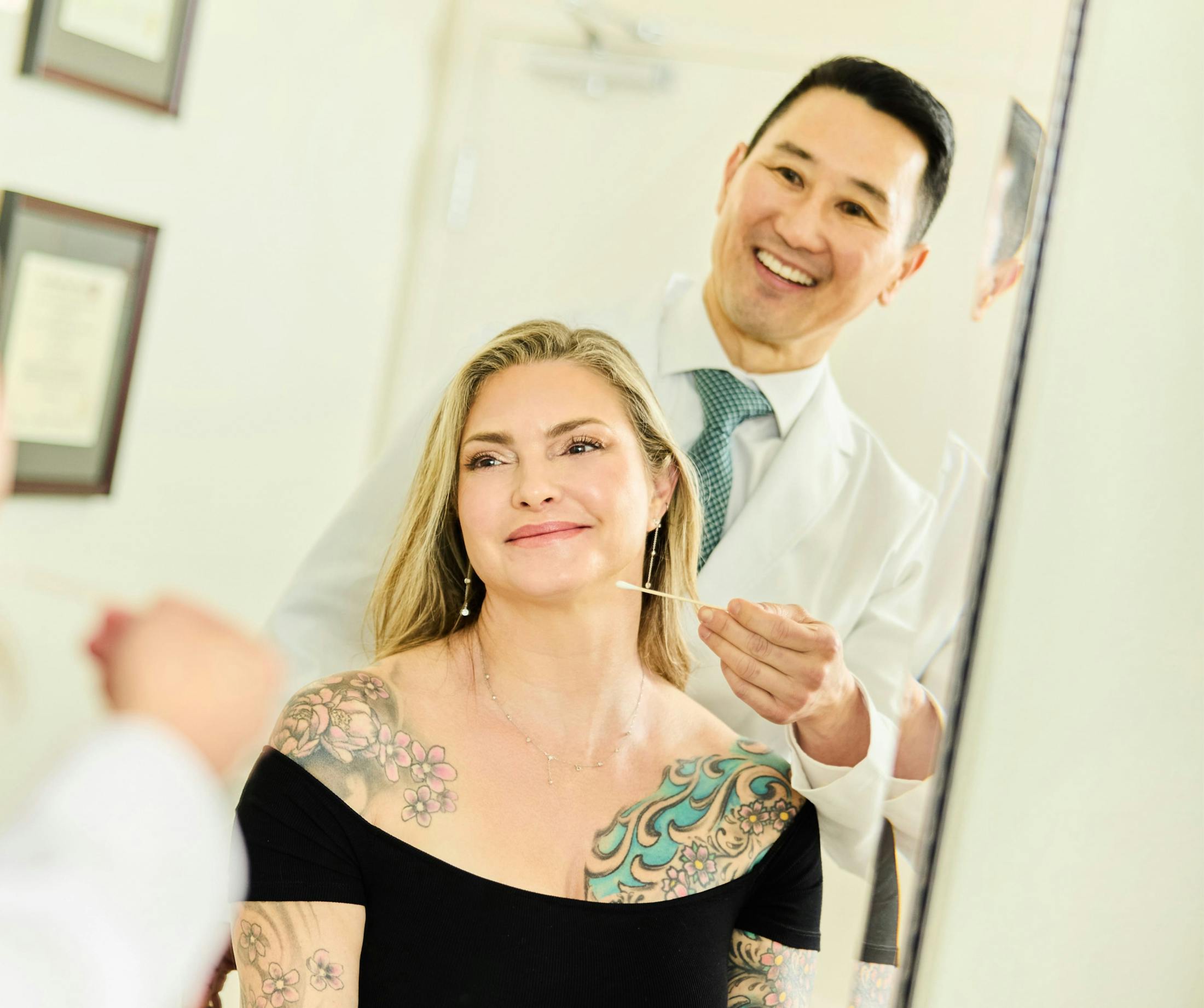 doctor inspecting blonde woman's face