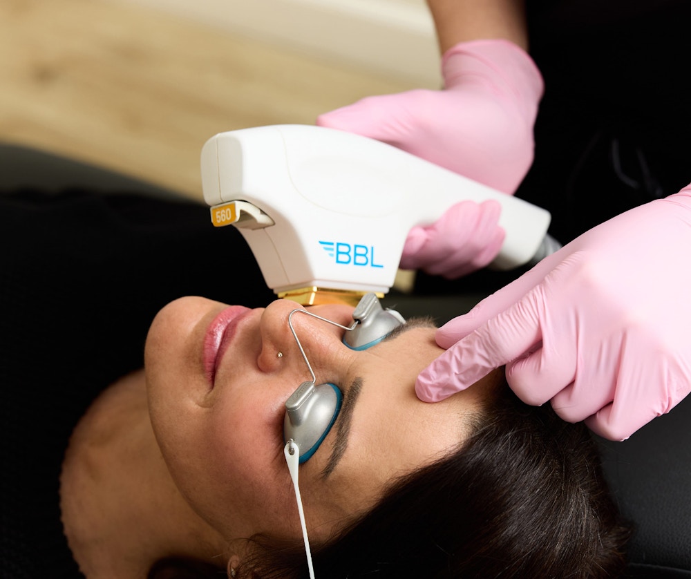 woman receiving facial treatment