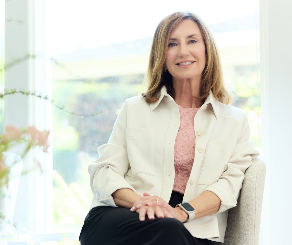 woman sitting on chair smiling